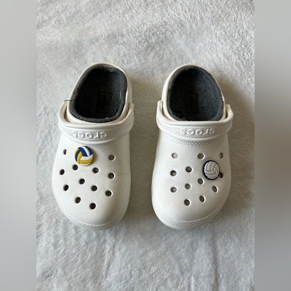 CROCS Shoes - CROCS women’s White Slippers with Sports Charms